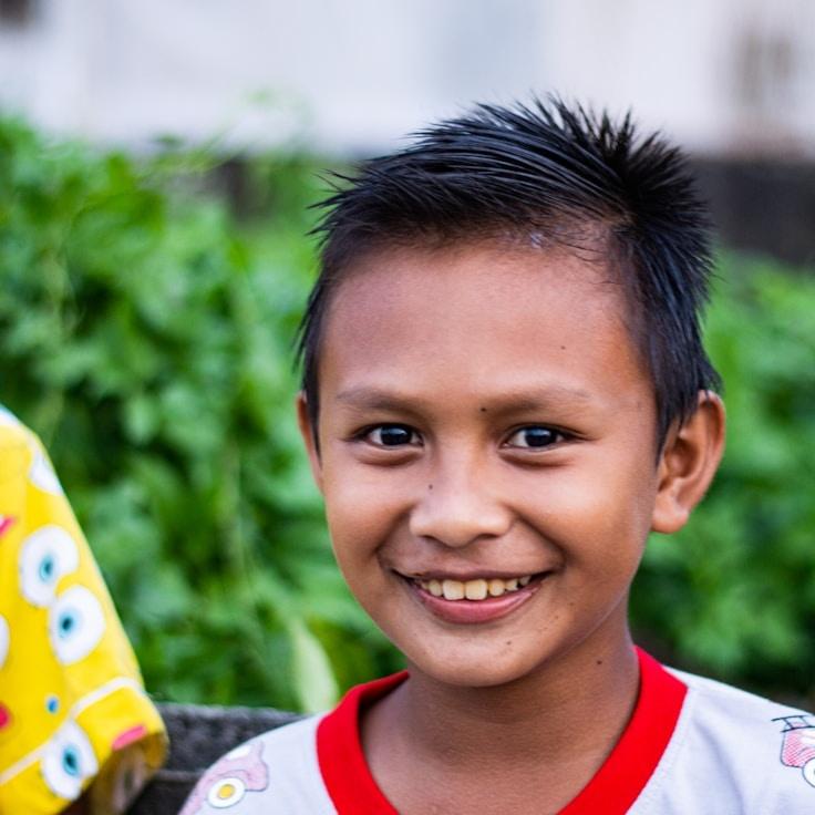 Avery Sloan, Lead Design Curator at TimberLatticeWay, reviewing corporate floral arrangements